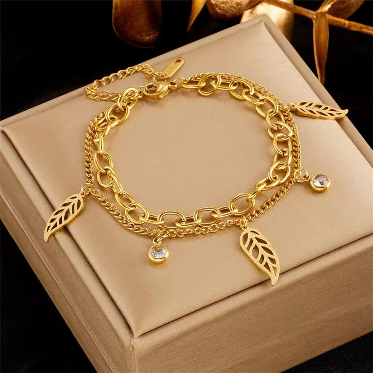 women's animal-themed bracelets-Simple Style Commute Leaves Titanium Steel Hollow Out Inlay Artificial Rhinestones 18k Gold Plated Bracelets