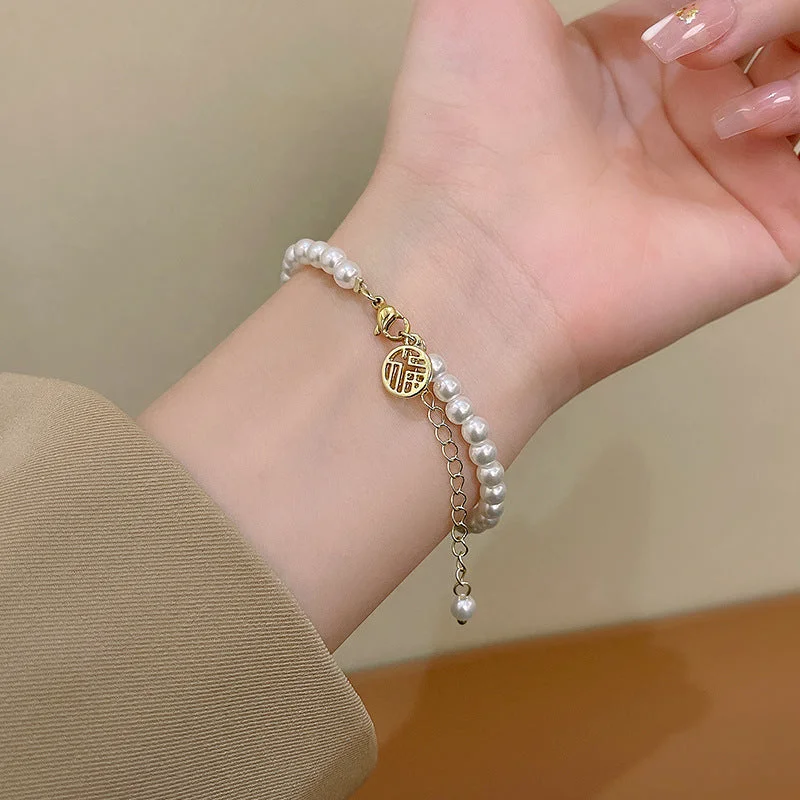 S389 Gold-Fu Character Pearl Bracelet