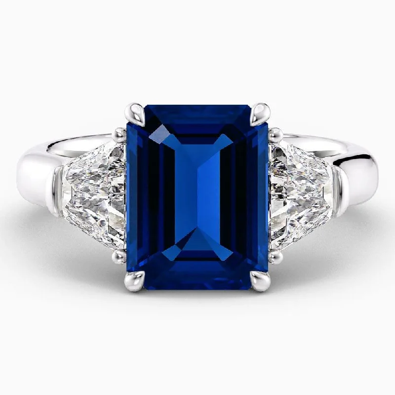 women's custom halo engagement rings-6 Carat Emerald Shape Three Stone Blue Sapphire Engagement Ring